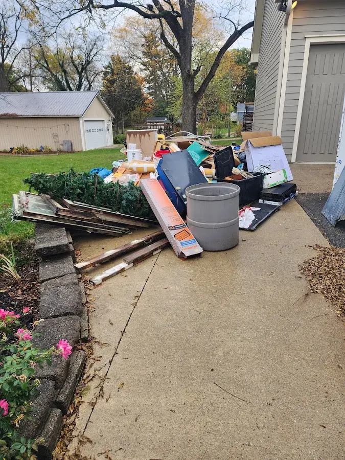 Dumpster being loaded with debris for 3 Yard Dumpster Rental in Lewisburg